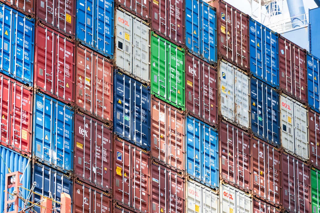Stacked shipping containers in a logistics storage yard