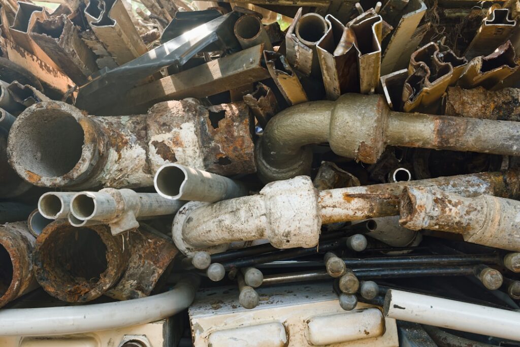 Stacked steel pipes in an industrial yard